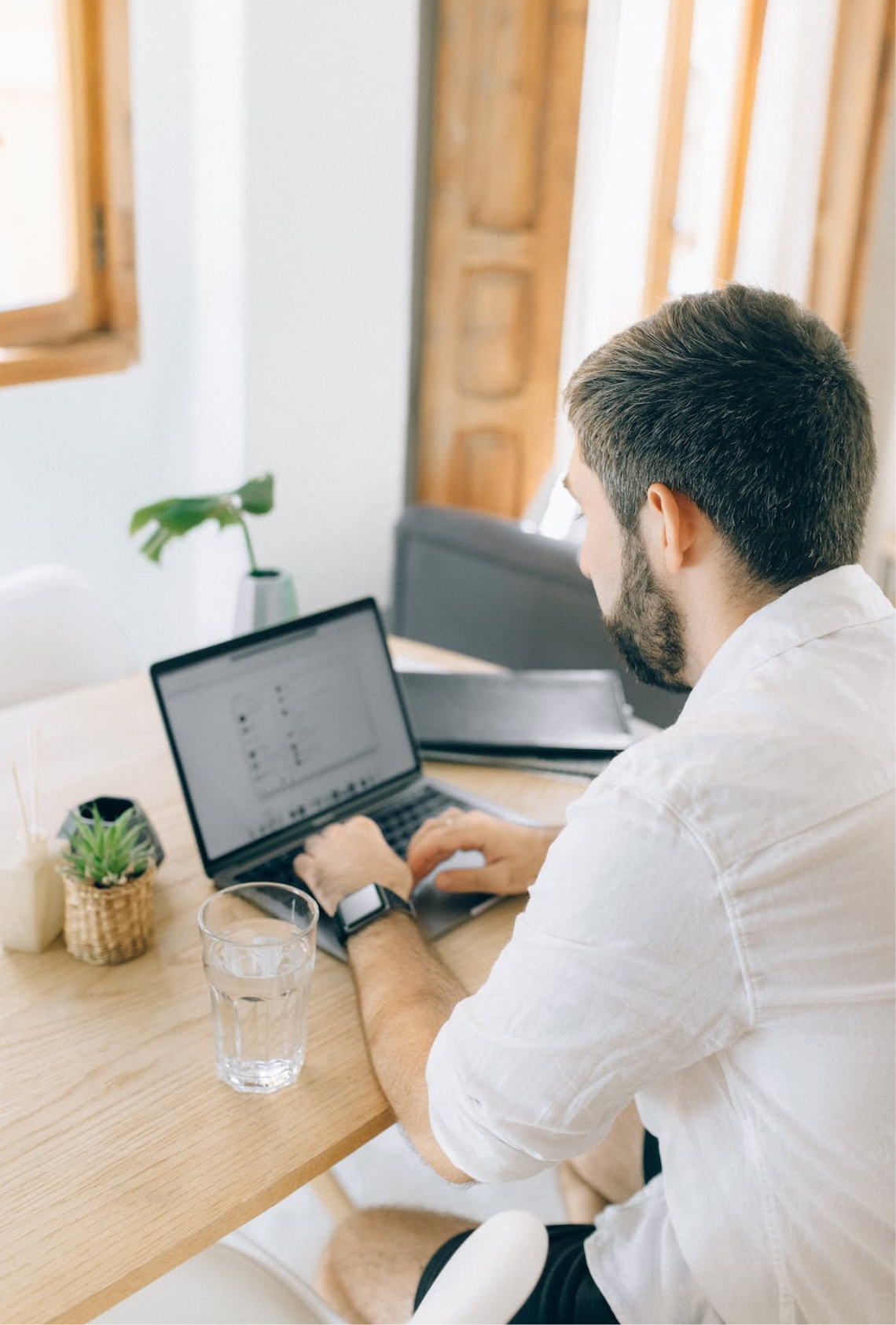 Man sitting behind his laptop